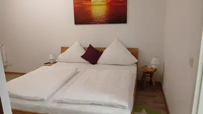 Ein Bett oder Betten in einem Zimmer der Unterkunft Rosenberg