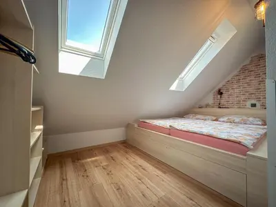 Ein Bett oder Betten in einem Zimmer der Unterkunft Ferienweingut Emmerich