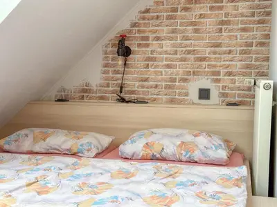 Ein Bett oder Betten in einem Zimmer der Unterkunft Ferienweingut Emmerich
