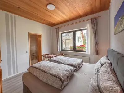 Ein Bett oder Betten in einem Zimmer der Unterkunft Hermes-Lex Weingut