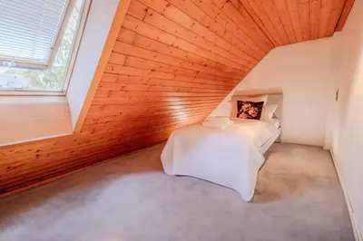 Ein Bett oder Betten in einem Zimmer der Unterkunft Villa Panoramica Pool & Sauna