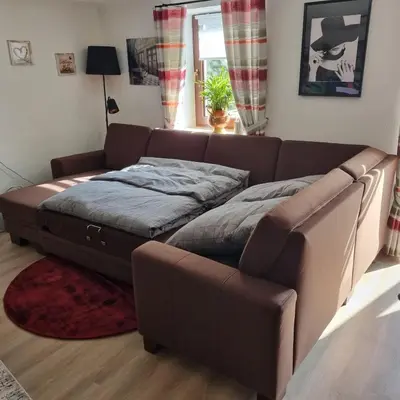 Ein Sitzbereich in der Unterkunft Ferienwohnung Zum Freihof