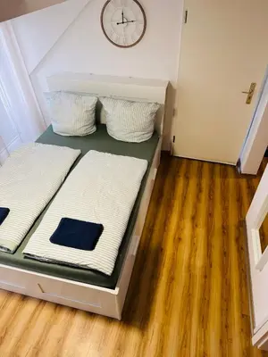 Ein Bett oder Betten in einem Zimmer der Unterkunft Balkonwohnung in Moselnähe