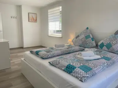 Ein Bett oder Betten in einem Zimmer der Unterkunft Holunder nah am Waldsee 1