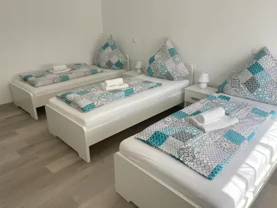 Ein Bett oder Betten in einem Zimmer der Unterkunft Holunder nah am Waldsee 1
