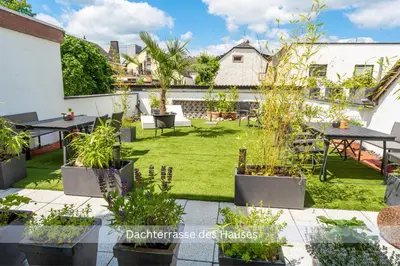 Ein Garten an der Unterkunft Bambuszimmer mit großem Dachgarten im Gästehaus Graf-Schmelzer