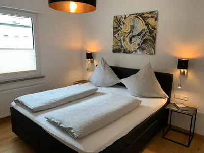 Ein Bett oder Betten in einem Zimmer der Unterkunft Ferienwohnungen Rees
