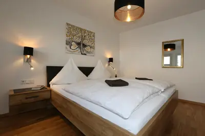 Ein Bett oder Betten in einem Zimmer der Unterkunft Ferienwohnungen Rees
