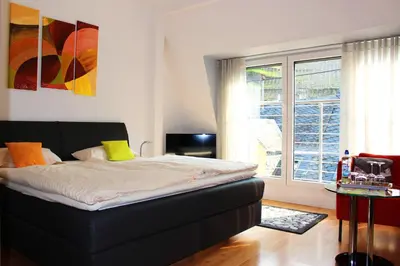 Ein Bett oder Betten in einem Zimmer der Unterkunft Pension Adelheid Moselhype&Wine