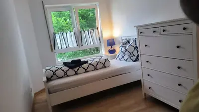 Ein Bett oder Betten in einem Zimmer der Unterkunft Spacious Ferienwohnung nähe KOB Uni