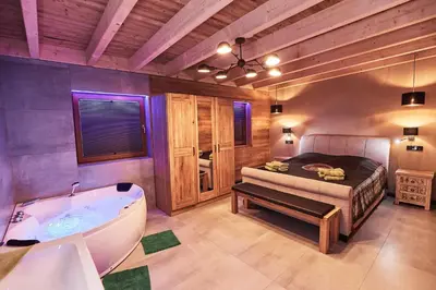 Ein Bett oder Betten in einem Zimmer der Unterkunft Wellness Ferienhaus “Lotus II”