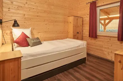 Ein Bett oder Betten in einem Zimmer der Unterkunft Ferienhaus Seepfadhäusle