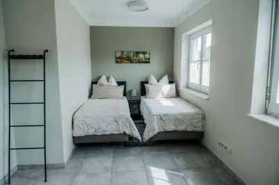 Ein Bett oder Betten in einem Zimmer der Unterkunft FeWo Vulkaneifelzeit / nahe Nürburgring