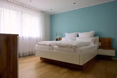 Ein Bett oder Betten in einem Zimmer der Unterkunft Wein- u. Gästehaus St. Maximin