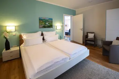 Ein Bett oder Betten in einem Zimmer der Unterkunft Wein- u. Gästehaus St. Maximin