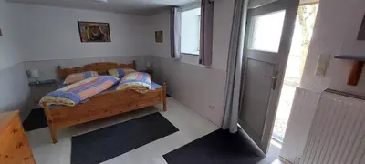 Ein Bett oder Betten in einem Zimmer der Unterkunft Mühlbachhof