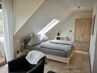 Ein Bett oder Betten in einem Zimmer der Unterkunft Moseltalblick