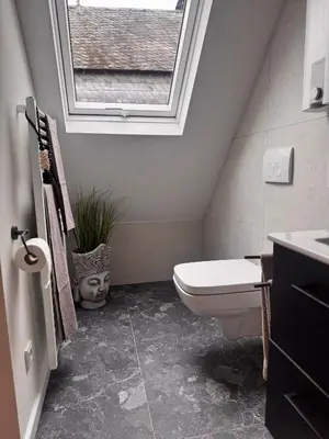Ein Badezimmer in der Unterkunft theroof