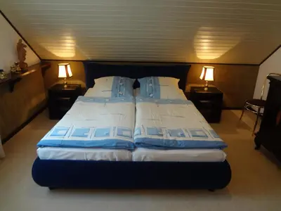 Ein Bett oder Betten in einem Zimmer der Unterkunft Gästehaus am Ahornweg
