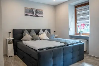 Ein Bett oder Betten in einem Zimmer der Unterkunft Ferienwohnung by Ingrida