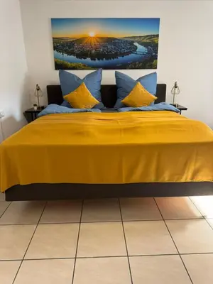 Ein Bett oder Betten in einem Zimmer der Unterkunft Moselgold Apartment