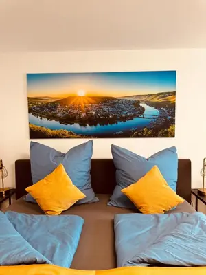 Ein Bett oder Betten in einem Zimmer der Unterkunft Moselgold Apartment