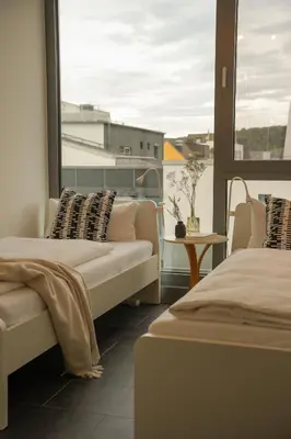 Ein Bett oder Betten in einem Zimmer der Unterkunft Maisonette Stadtglück Koblenz