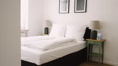 Ein Bett oder Betten in einem Zimmer der Unterkunft Stilvolles Apartment für 4 Gäste