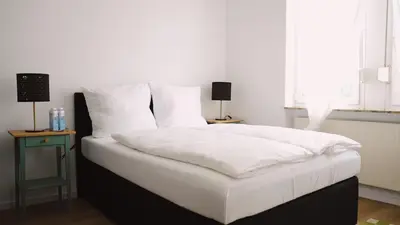 Ein Bett oder Betten in einem Zimmer der Unterkunft Stilvolles Apartment für 4 Gäste