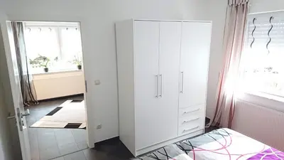 Ein Bett oder Betten in einem Zimmer der Unterkunft Gästehaus Ballmann 2