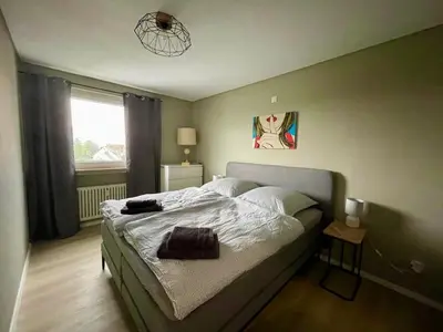 Ein Bett oder Betten in einem Zimmer der Unterkunft Loreley - Panorama Suite mit Penthouse-Feeling