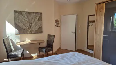 Ein Bett oder Betten in einem Zimmer der Unterkunft RHEIN-WALD Exklusives Apartment mit Rheinblick