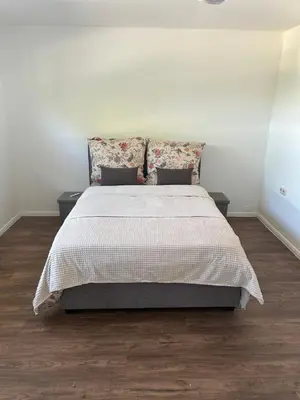 Ein Bett oder Betten in einem Zimmer der Unterkunft Ferienwohnung in Wimbach am Nürburgring