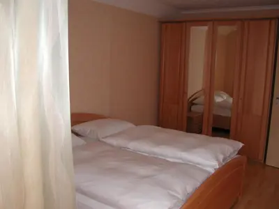 Ein Bett oder Betten in einem Zimmer der Unterkunft Gästehaus