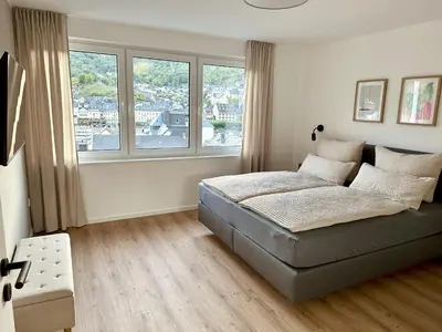 Ein Bett oder Betten in einem Zimmer der Unterkunft Moselvilla Thiesen