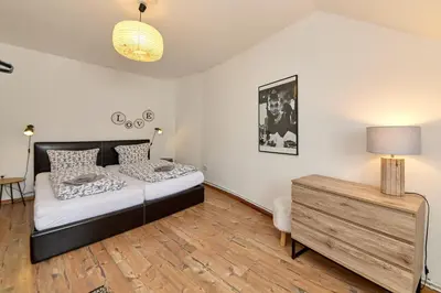 Ein Bett oder Betten in einem Zimmer der Unterkunft Altstadt Residenz Wohnung 3