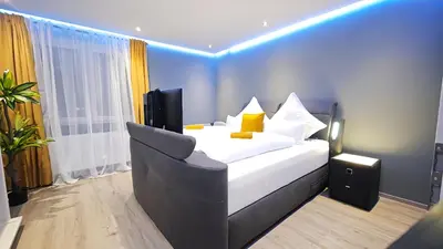 Ein Bett oder Betten in einem Zimmer der Unterkunft DANESSI-Familie,Business,nahe Koblenz,6 Personen,Saniert,direkte Anbindung Industriegebiet,TV Kingsize Boxspringbett