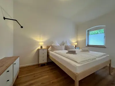Ein Bett oder Betten in einem Zimmer der Unterkunft Ferienhaus am Golfplatz