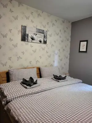 Ein Bett oder Betten in einem Zimmer der Unterkunft Haus Blumengarten