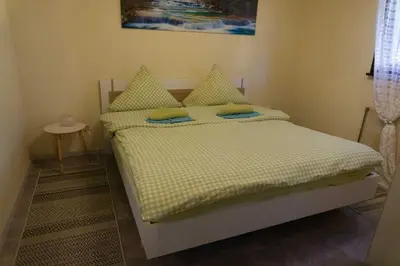 Ein Bett oder Betten in einem Zimmer der Unterkunft Haus Waldfrieden EG