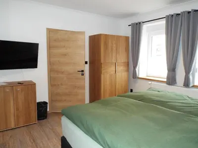 Ein Bett oder Betten in einem Zimmer der Unterkunft Feriendomizil-Vulkaneifel
