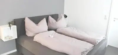 Ein Bett oder Betten in einem Zimmer der Unterkunft Ferienwohnung Kleine Auszeit
