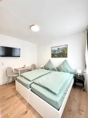 Ein Bett oder Betten in einem Zimmer der Unterkunft Privatzimmer in Apartment Brunnenstraße Braubach