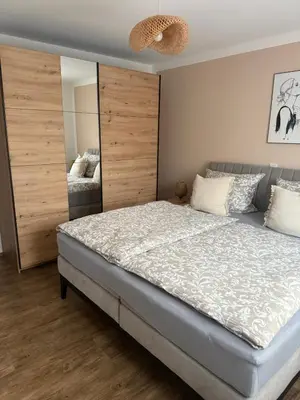 Ein Bett oder Betten in einem Zimmer der Unterkunft Ferienwohnung am Krausbach