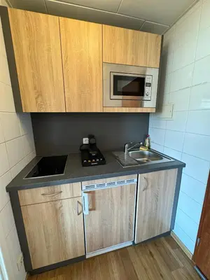 Küche/Küchenzeile in der Unterkunft RheinBlick Apartment - Park and Stay 