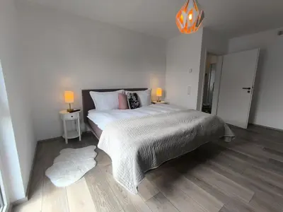 Ein Bett oder Betten in einem Zimmer der Unterkunft VILLA VULKANEIFEL -modern -familienfreundlich -Terrasse -Doppelgarage -ruhiger Lage