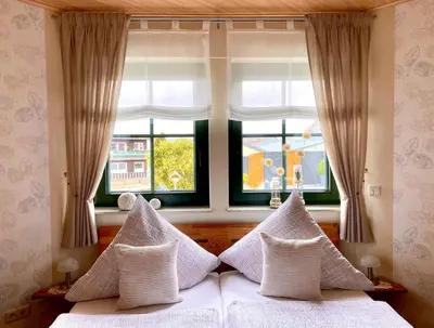 Ein Bett oder Betten in einem Zimmer der Unterkunft Gästezimmer Engels