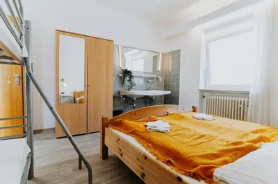 Ein Bett oder Betten in einem Zimmer der Unterkunft Gemütliches Gästehaus am Rhein!