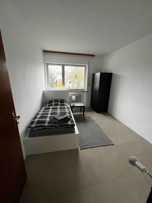 Ein Bett oder Betten in einem Zimmer der Unterkunft Wohlfühlen mit viel Raum und Garten am RHEIN