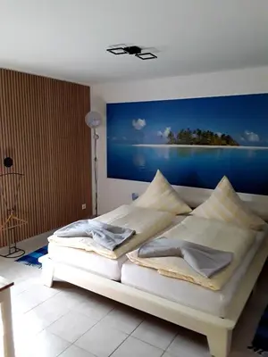 Ein Bett oder Betten in einem Zimmer der Unterkunft Pension Müller